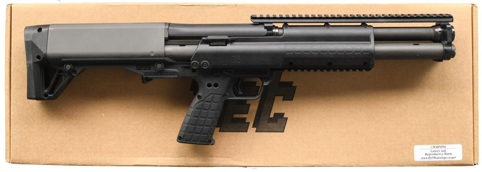 KEL-TEC KSG BULLPUP PUMP ACTION SHOTGUN WITH: MATCHING FACTORY BOX. Cal. 12 GA, 3". S# XXZ494. Bbl. 18 5/8". KSG bullpup pump action shotgun mfg. by Kel-Tec. The left side of the receiver is marked with Kel-Tec's mfg. information, above the model