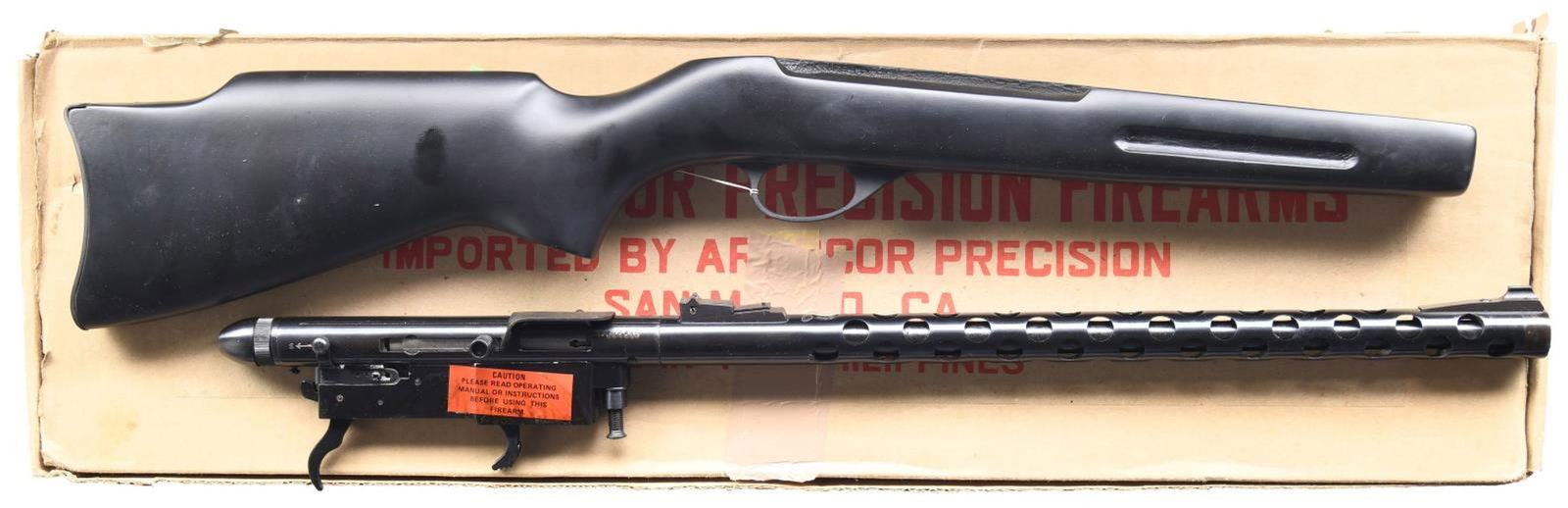 ARMSCOR M505 SEMI AUTO RIFLE.: Cal. 22 LR. S# A639512. Bbl. 18" w/ shroud. Ramped blade front sight. Ramped U-notch rear sight. Armscor-made rimfire rifle. Matte black finish. Black synettic pistol grip stock. MAGS: 1–30 rd.