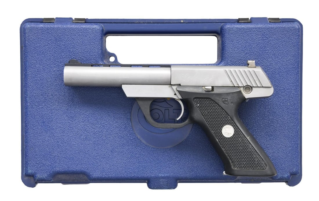 COLT 22 SEMI AUTO PISTOL.: Cal. 22 LR. S# PH35928. Bbl. 4 1/2" w/ VR. Blade front sight. Square notch rear sight. Stainless finish. Checkered black grip frame w/ silver Rampant Colt Medallions. MAGS: 2-10 rd. UNATTACHED ACCESSO