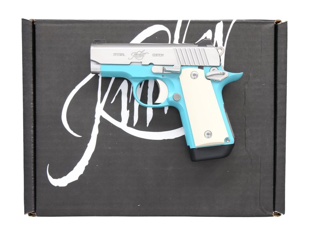 KIMBER MICRO-BEL AIR SEMI AUTO PISTOL.: Cal. 380 ACP. S# P0112399. Bbl. 2 3/4". Three dot night sights. Polished stainless slide. Bel air blue finished frame. Ivory style grips. MAGS: 1-7 rd. UNATTACED ACCESSORIES: matching numbered factory