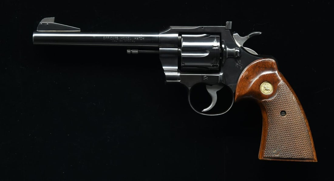 COLT OFFICERS MODEL MATCH REVOLVER.: Cal. 38 Special. S# 918467. Bbl 6”. Colt Officers Model Match with a partridge front sight, fully adjustable rear sight, and semi-beavertail hammer. Left side of barrel marked with the model and
