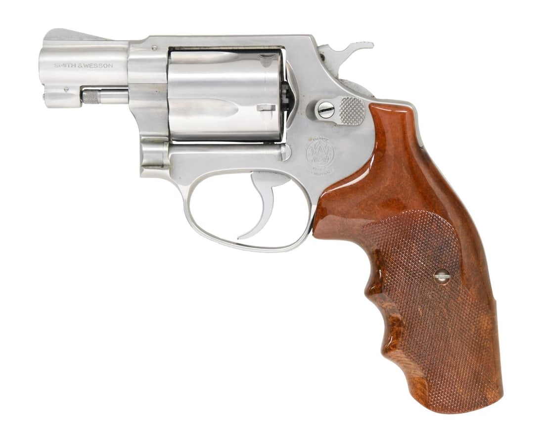 SMITH & WESSON MODEL 60 DOUBLE ACTION REVOLVER.: Cal. 38 Spec. S# R244883. Bbl. 1 7/8". Model 60 double action revolver mfg. by Smith & Wesson. The left side of the bbl. is marked "SMITH & WESSON", with the cal. designation on the right. Left side o
