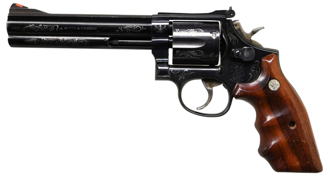 ENGRAVED SMITH & WESSON MODEL 586-2 DOUBLE ACTION: Cal. 357 Mag. S# BBV2326. Bbl. 5 7/8". Model 586-2 double action revolver mfg. by Smith & Wesson. The left side of the bbl. is marked "SMITH & WESSON", with the cal. designation marked on the right. L