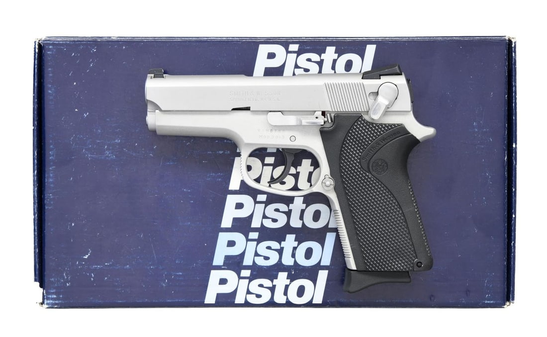 SMITH & WESSON MODEL 3913 SEMI-AUTOMATIC PISTOL: WITH MATCHING FACTORY BOX. Cal. 9x19mm Parabellum. S# VAH8768. Bbl. 3 3/8". Model 3913 semi-automatic pistol mfg. by Smith & Wesson. The left side of the slide is marked "SMITH & WESSON" above S&W's m