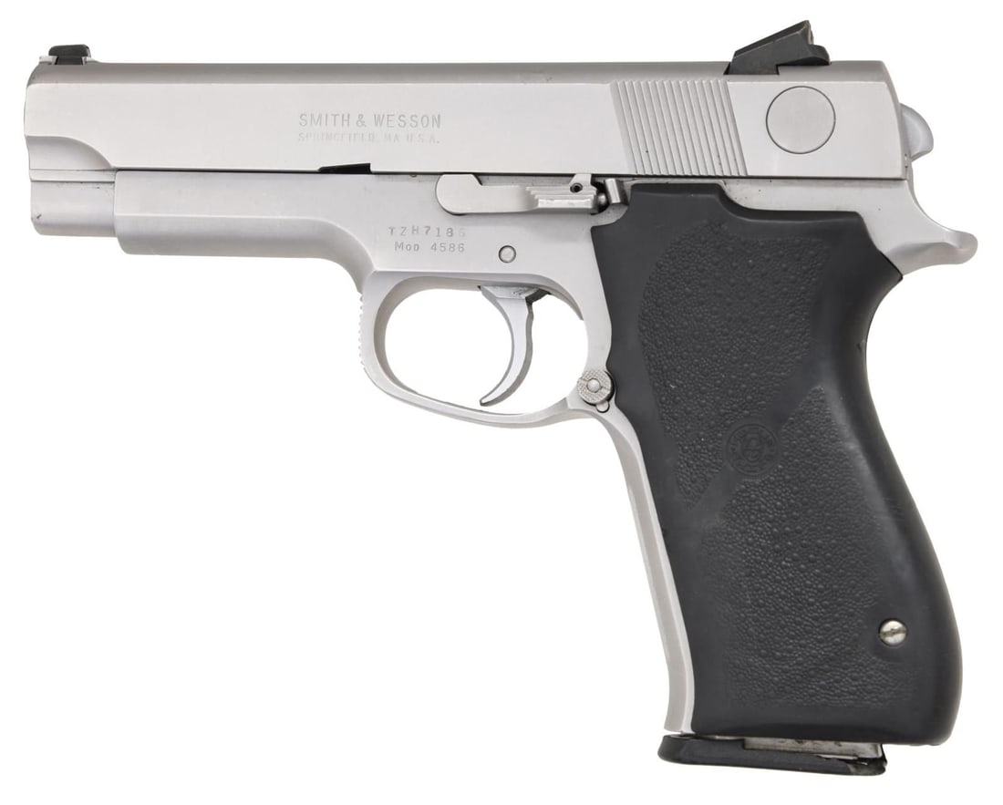 SMITH & WESSON MODEL 4586 SEMI-AUTOMATIC PISTOL.: Cal. 45 ACP. S# TZH7186. Bbl. 4 1/8". Model 4586 semi-automatic pistol mfg. by Smith & Wesson. Left side of slide is marked with S&W's mfg. information. Left side of frame is marked with the S# above