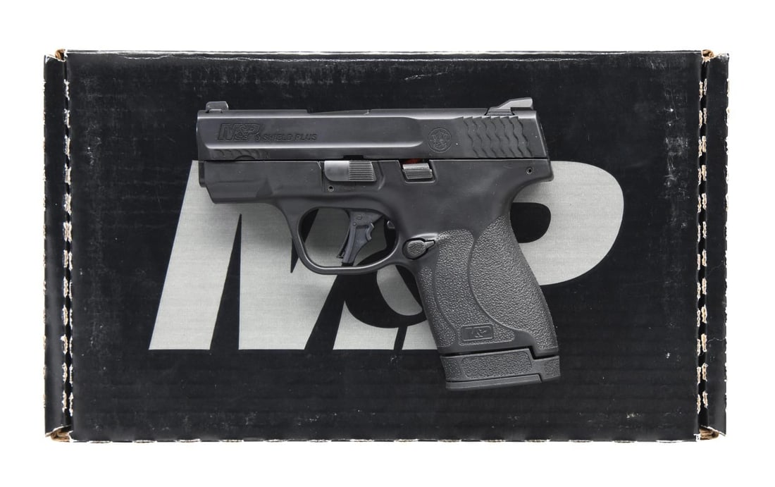 SMITH & WESSON M&P 9 SHIELD PLUS SEMI-AUTOMATIC: PISTOL WITH MATCHING FACTORY BOX. Cal. 9x19mm Parabellum. S# JHB6441. Bbl. 3". M&P 9 Shield Plus semi-automatic pistol mfg. by Smith & Wesson. Left side of slide is marked with the model designation,