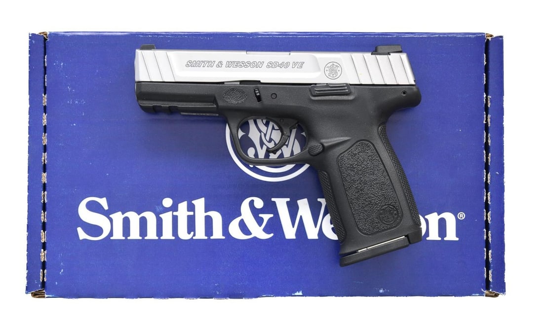 SMITH AND WESSON MODEL SD40 VE SEMI-AUTO PISTOL.: Cal. 40 S&W. S# FDL2137. Bbl. 4" stainless. Striker fired with stainless slide having front and rear cocking grooves. Black synthetic frame with checkered grip straps plus textured side panels and at