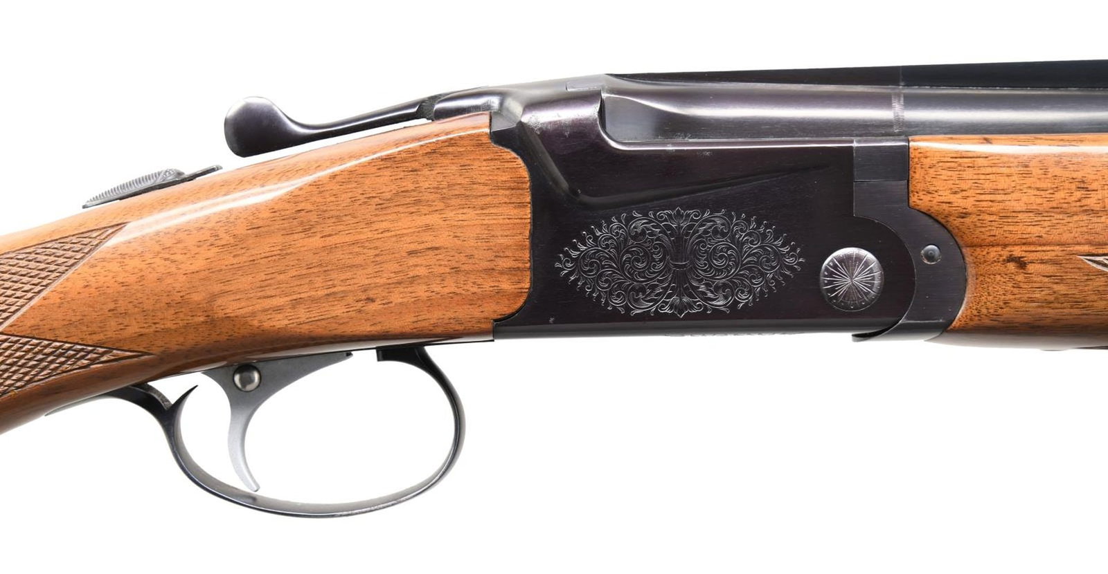 SKB ARMS MODEL 505 O/U FIELD SHOTGUN.: Cal. 20 ga. S# NA02599. Bbls. 26" vent rib w/ interchangeable chokes, IC & skeet tubes included. Brass bead. Scalloped boxlock action w/ scroll ornamentation. Satin finished SST. Selective ejectors. F