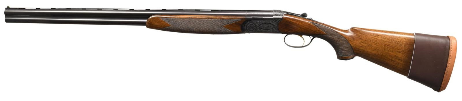 BERETTA BL-4 O/U SKEET SHOTGUN.: Cal. 20 ga. 3". S# X01906. Bbl. 26 1/4" w/ vent rib. Aftermarket Briley S59 chokes, 2 skeet tubes included. White target front sight w/ steel mid bead. Scalloped boxlock action w/ full coverage scroll