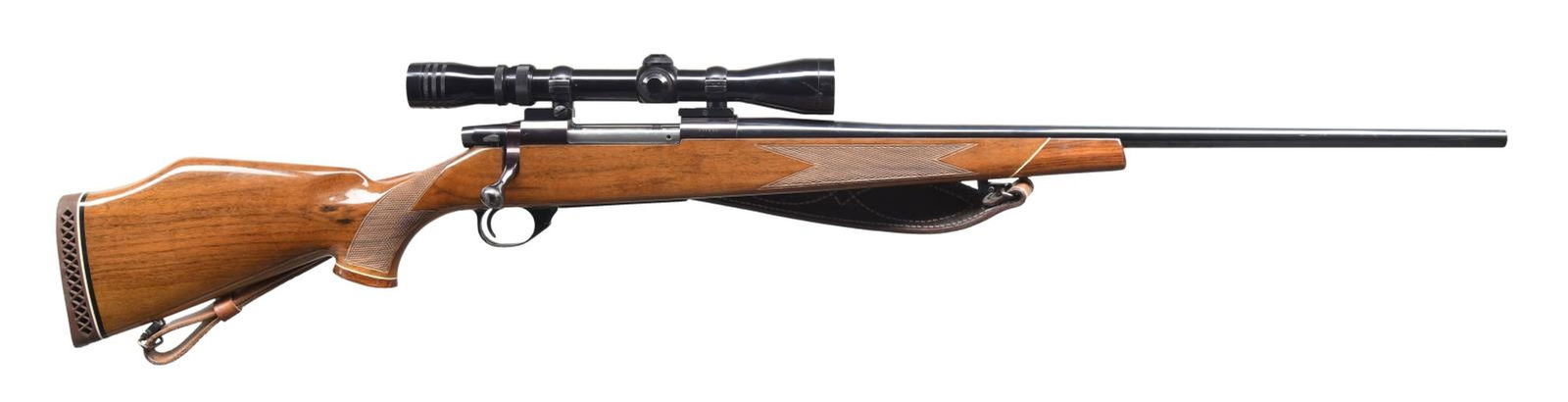 WEATHERBY VANGUARD BOLT ACTION RIFLE.: Cal. 300 Win Mag. S# V11595. Bbl. 24". Vanguard bolt action rifle mfg. in Japan by Howa and imported/retailed by Weatherby. Left side of bbl. is marked with the cal. designation at the breech. Left si