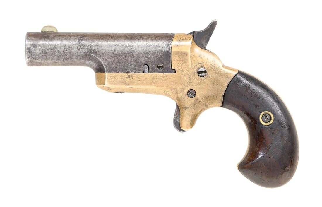 COLT THIRD MODEL THUER DERINGER SINGLE SHOT: PISTOL. Cal. 41 RF. S# 2599 (beneath left grip panel). Bbl. 2 1/2". Third Model Thuer single shot deringer pistol mfg. by Colt. Top of bbl. is marked "-COLT-". Brass frame with iron bbl., and 2-piece 