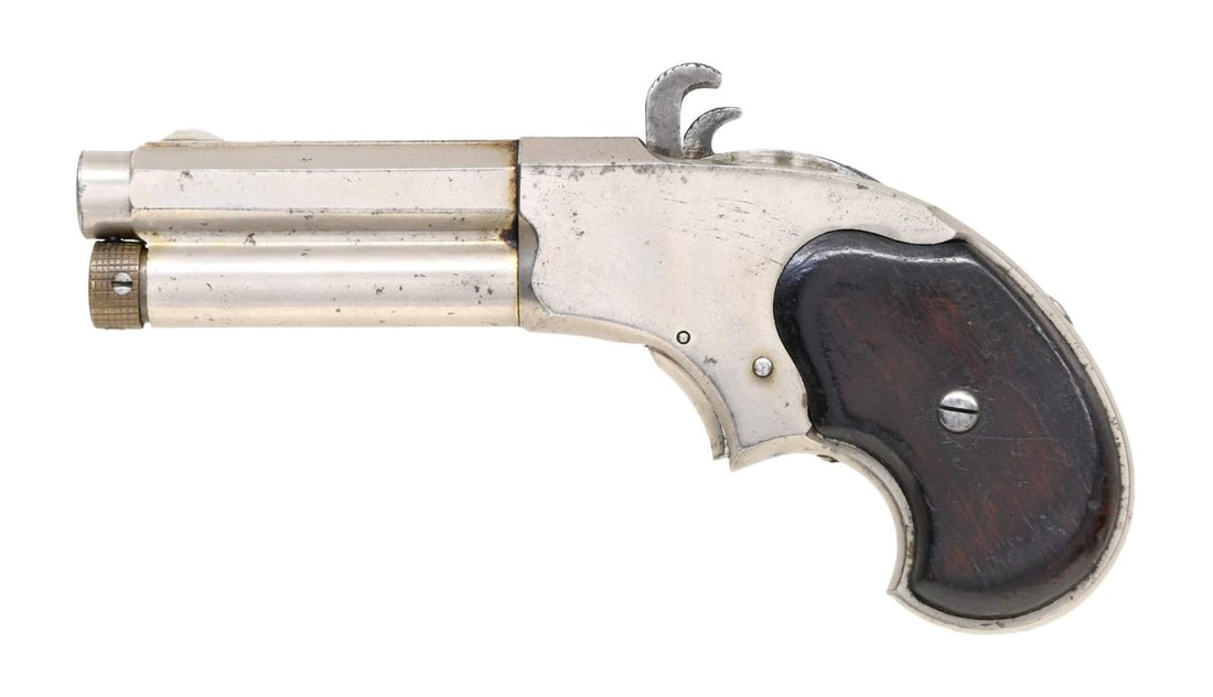 REMINGTON-RIDER MAGAZINE PISTOL.: Cal. 32 RF Extra Short. NSN. Bbl. 3", octagon bbl. with integral tubular mag. Breech block or cartridge carrier is positioned adj. to the hammer. Nickel finish. Two-piece walnut grips. Mfg. 1871-88. C