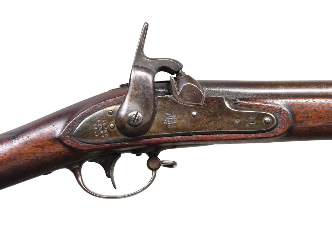HARPER'S FERRY MODEL 1816 PERCUSSION CONVERSION US: MUSKET. Cal. 69. NSN. Bbl. 42" smooth bore. Harper's Ferry conversion lock is dated 1851. Forward portion of lock is stamped "11". 3 band walnut stock w/ iron fittings. Left ear of stock has partially