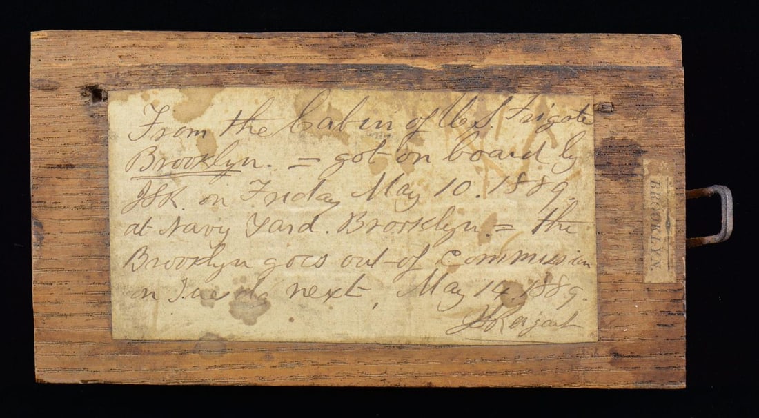 SOUVENIR OF THE CIVIL WAR SHIP USS BROOKLYN.: This 5" x 2 1/2" piece of cabin from the decommissioned USS Brooklyn was taken on May 10, 1889 from the Brooklyn Navy Yard. The USS Brooklyn was first commissioned as a sloop of war in 1858, having se
