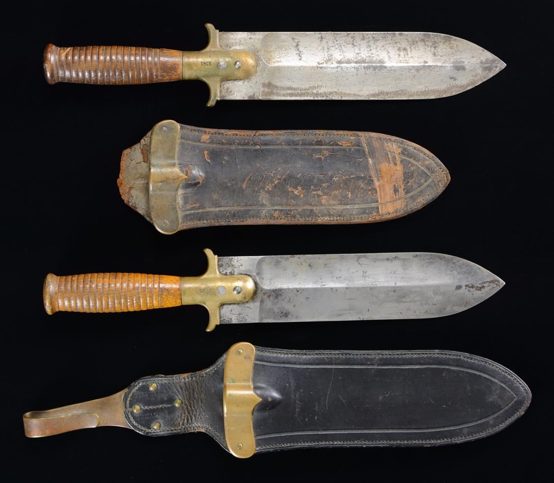 TWO SPRINGFIELD MODEL 1880 ALL PURPOSE KNIVES.: SN 2314, 2561. 13 1/2" overall, 8 1/2" double fullered spear point blade, medial ridge, one side sharpened. All purpose knife made for use by all troops. Brass guard stamped "US SPRINGFIELD" & serial 