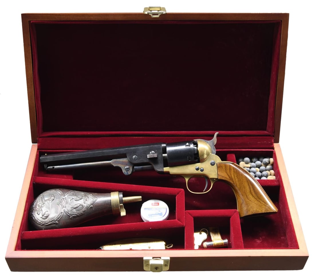 EIG 1851 NAVY REPRO REVOLVER.: Cal. 36. S# 27106. Bbl. 7 1/2". Brass bead front sight. Italian repro cap & ball 1851 Navy-style revolver. Blued bbl. and cyl. Case-colored loading lever and hammer. Brass frame & grip assembly. Smoot