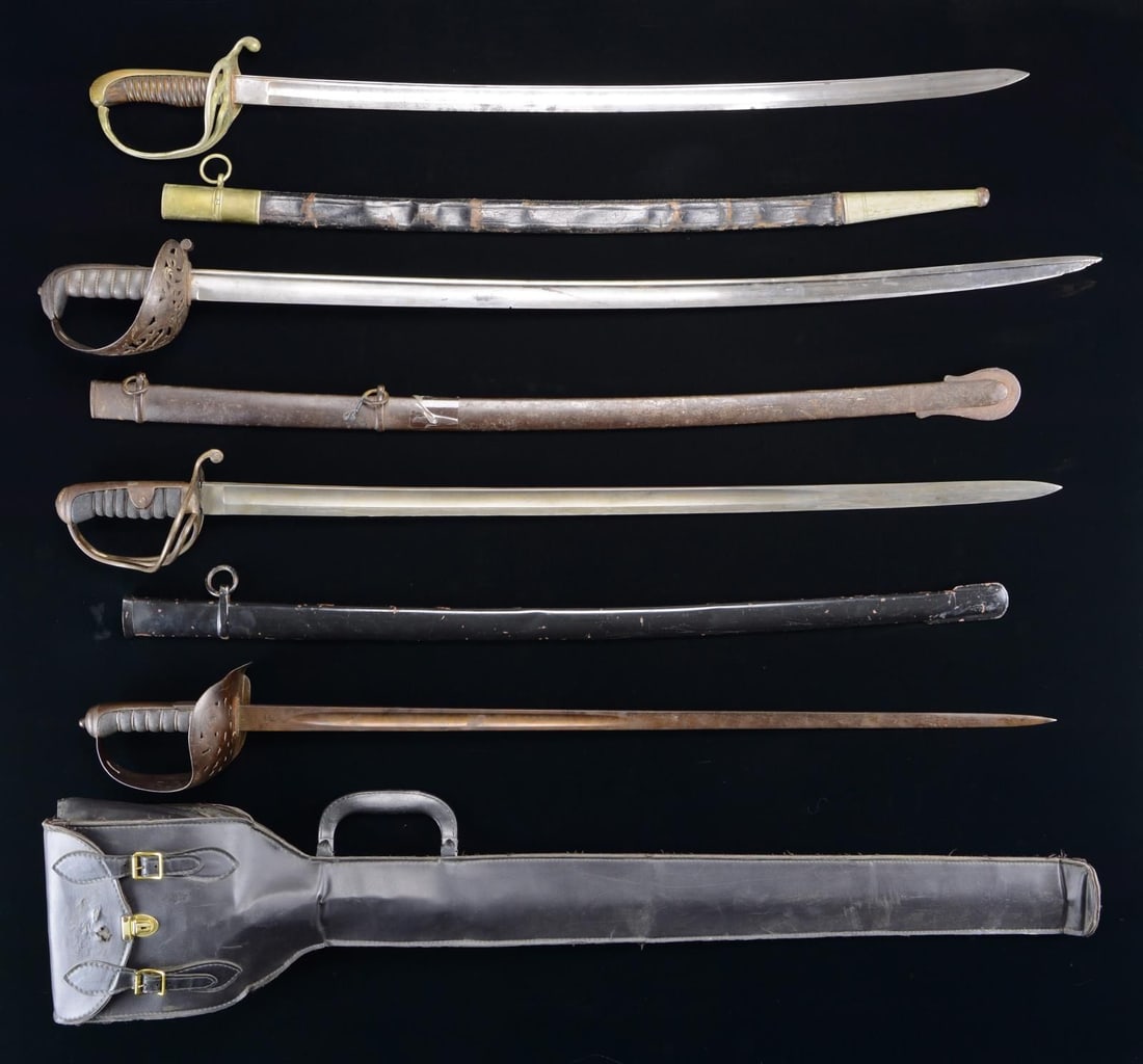 5 EUROPEAN SWORDS & SABERS.: 1) BRITISH. Overall length: 39 1/4". Blade length: 32 3/8”. The blade has a single 12 1/2" medium fuller in the center. The blade is marked near the hilt “(crown) 49 W” with two armo