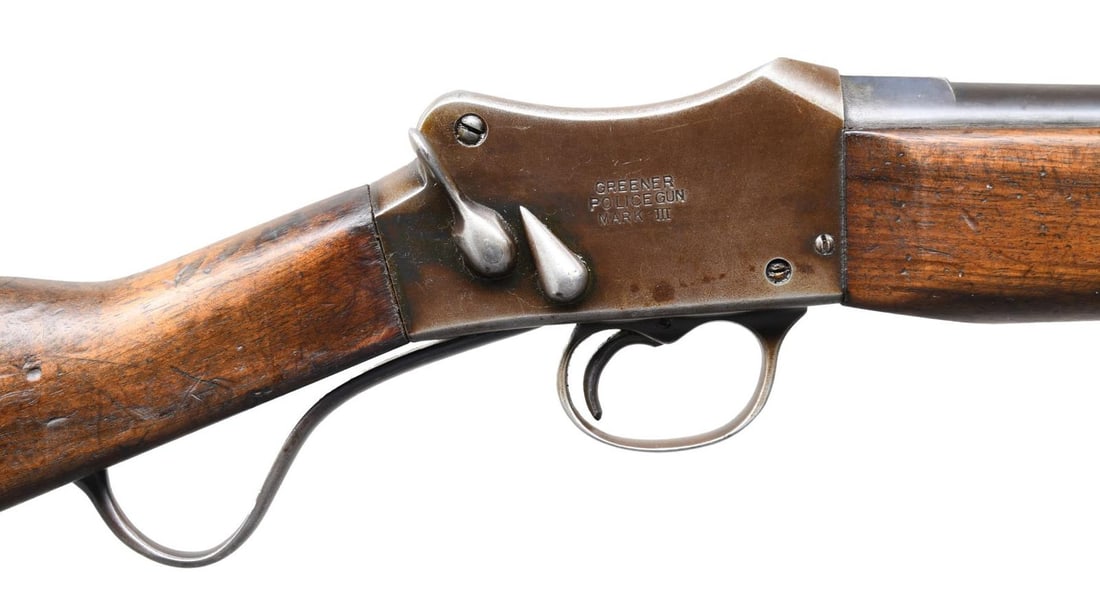 WW GREENER MARK III POLICE GUN SINGLE SHOTGUN.: Cal. 14 ga. S# 8826. Bbl. 26". Martini-style action with cocking indicator and safety lever on the right side. Full-length band-fastened walnut forearm with front sight on the forend cap. Straight-gri