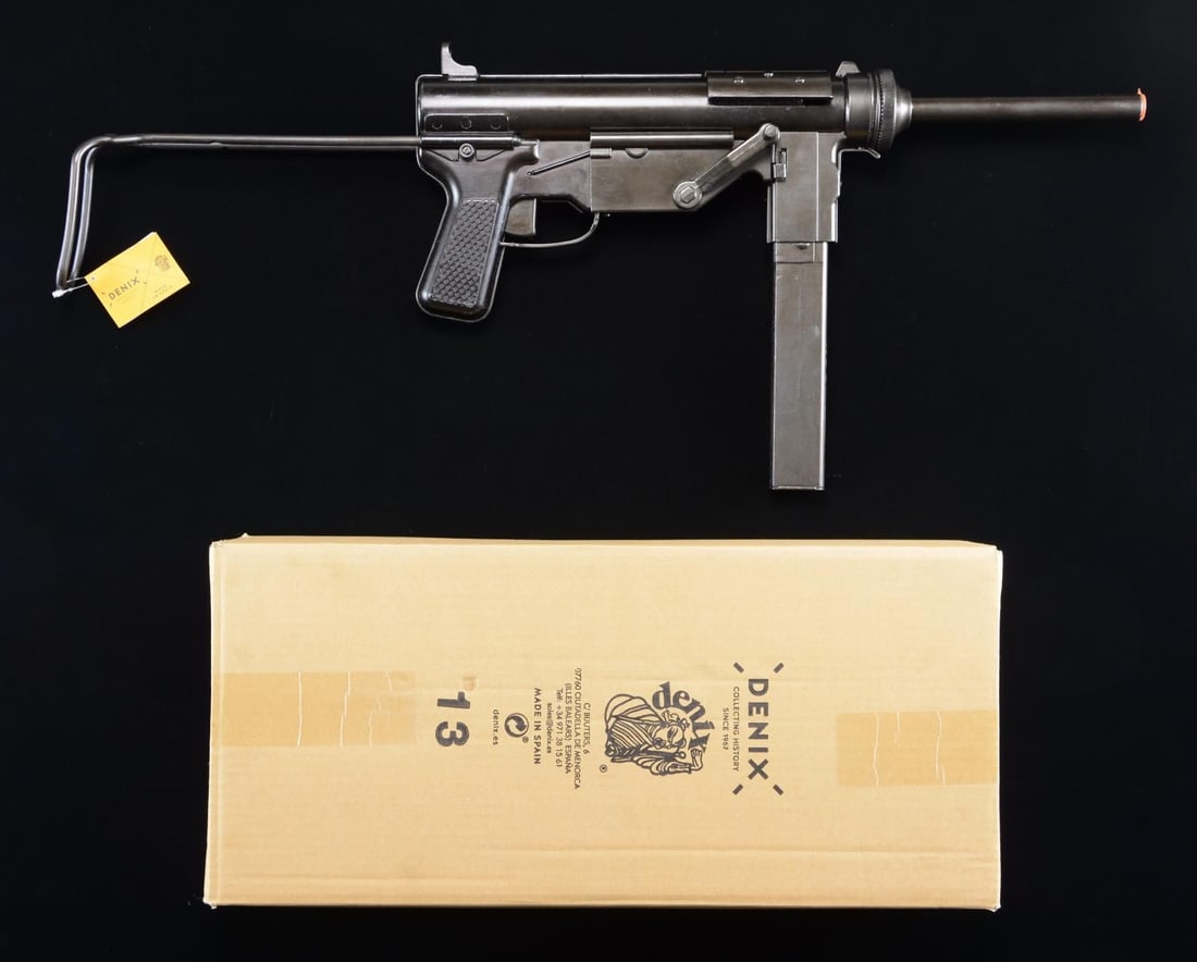 DENIX REPLICAS DX1313 M3 GREASE GUN.: Non-firing replica of WWII US M3 "Grease Gun". 23 1/4" overall. Black metal finish. Comes with box, replica mag., and stock. CONDITION: very good metal finish with light marks. (02-22398/MD). $100-200