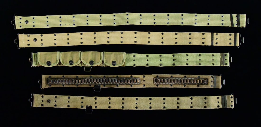 5 U.S. WWI MILITARY WEB BELTS.: 1) MILLS MODEL 1912 WEB BELT. Belt is marked on the tab "MADE BY / MILLS WOVEN CARTRIDGE BELT CO. WORESTER MASS U.S.A.". Belt has eagle rimless snap to position mag. pouch plus 2 sliding keepers. Fitt