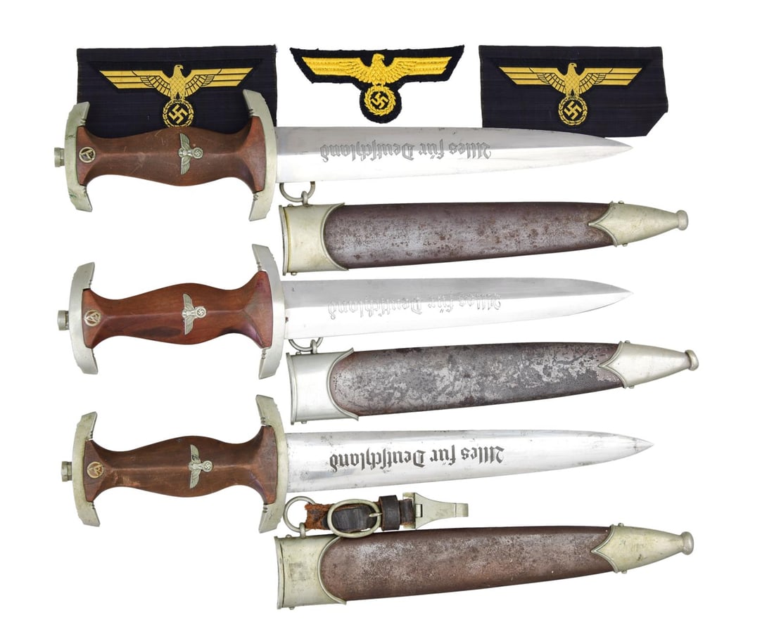 3 WWII GERMAN SA DAGGERS & 3 NAVY BREAST EAGLES.: 1) Overall length: 14 3/4". Blade is etched “Alles fur Deutschland” on the front and stamped “GEBR. HELLER” on the reverse. Nickel silver crossguard stamped “Th” on the reverse