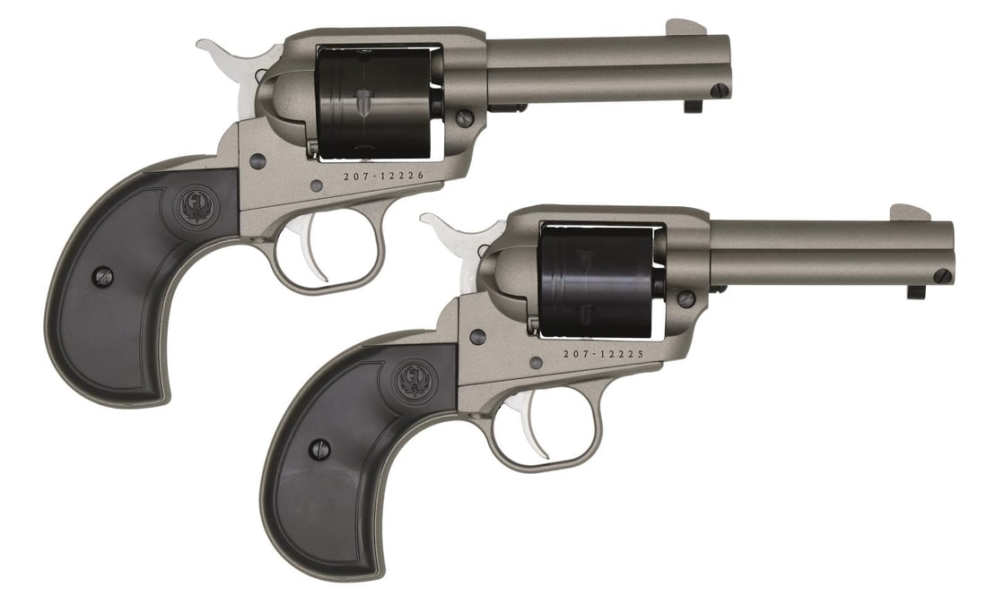 CONSECUTIVELY NUMBERED PAIR OF RUGER WRANGLER: SINGLE ACTION REVOLVERS WITH MATCHING FACTORY BOXES. Cal. 22 LR. S# 207-12226 & 207-12225. Pair of consecutively numbered Wrangler single-action revolvers mfg. by Ruger in 2022. Undersides of the bbls