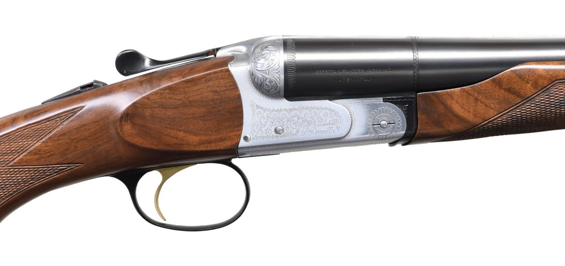 BERETTA 426 E SXS SHOTGUN.: Cal. 12 ga. 3". S# A40802A. Bbl. 28" with steel bead. Interchangeable chokes. IC and skeet tubes included. Satin-finished scalloped boxlock action with scroll ornamentation. Top lever has a silver pig