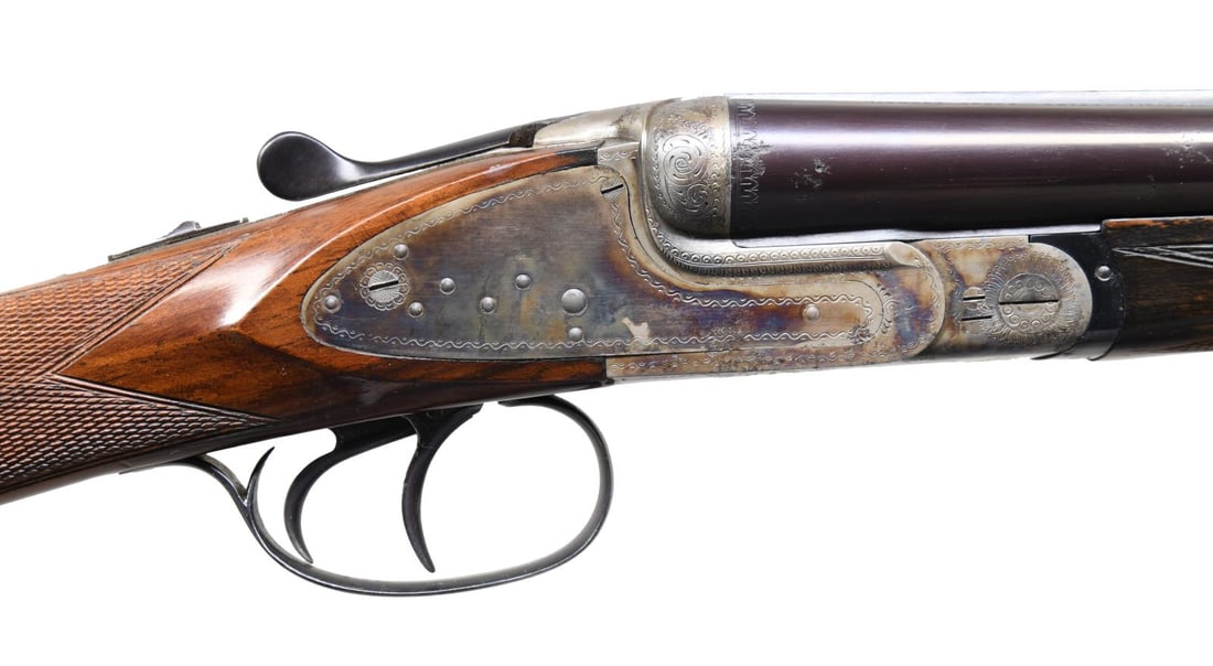 V. BERNARDELLI ROMA III SXS SHOTGUN.: Cal. 20 ga. 3". S# 124591. Bbl. 27 1/2" of special steel with brass bead. Fixed IC and full chokes. Case-colored sidelock action with borderline engraving and scroll highlights. Double triggers; the f