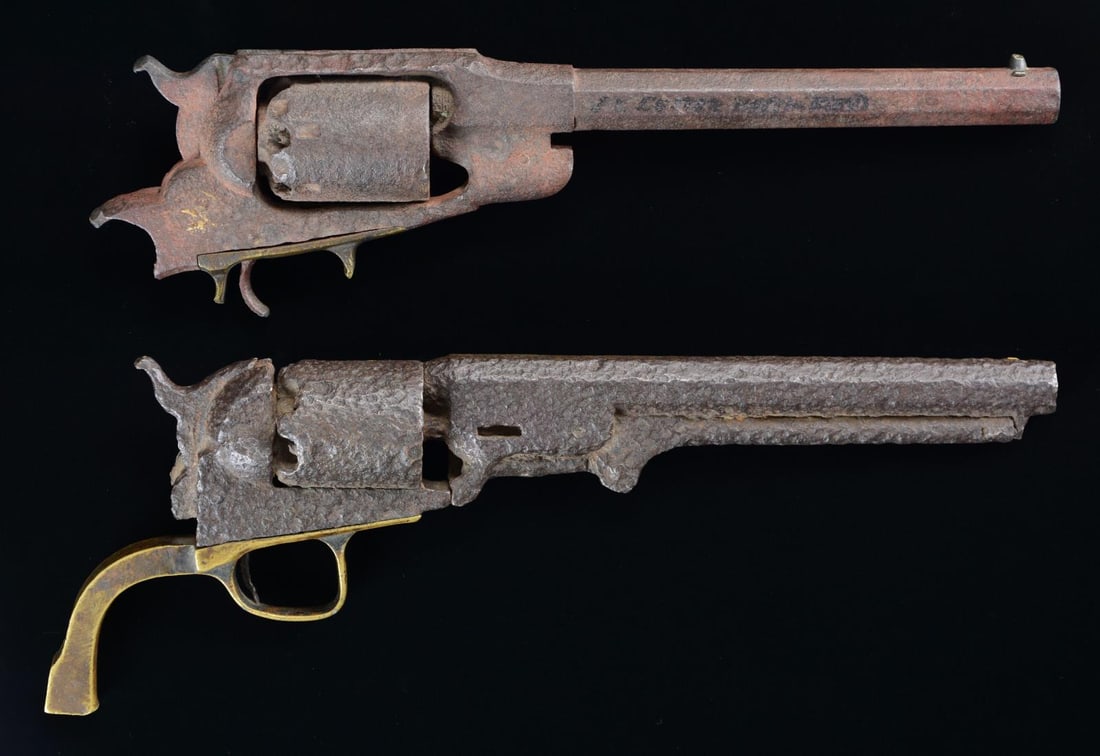 PAIR OF EXCAVATED CIVIL WAR REVOLVERS.: Colt M-1851 Navy, S# 142838 made in 1863, lacking backstrap but otherwise complete. Remington New Model Navy revolver lacks loading assembly, grip frame, and trigger bow, no discernible markings. No i