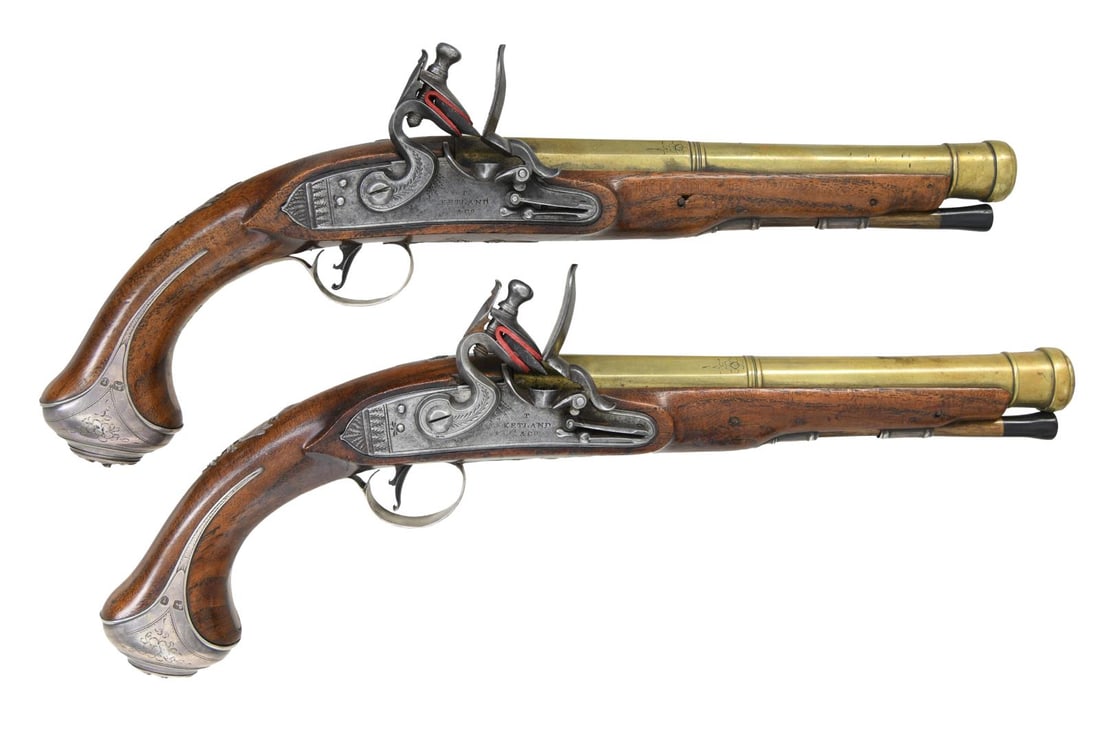 GOOD PAIR OF BRASS CANNON BARRELED SILVER MOUNTED: FLINTLOCK HOLSTER PISTOLS BY T. KETLAND & CO. Cal. 70. S# 259479 & S# 259480. Thomas Ketland is known to have been working in Birmingham circa 1760 into the early 19th Century. He was quite prolific a