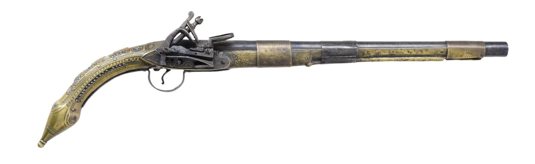 TURKISH RAT TAIL MIQUELET PISTOL.: Cal. 65. NSN. Bbl. 14 1/8". Turkish Miquelet pistol produced by an unknown maker. Iron lock assembly, rnd. bbl., trigger guard, and stamped central bbl. "band". Rat tail stock is comprised of brass, f