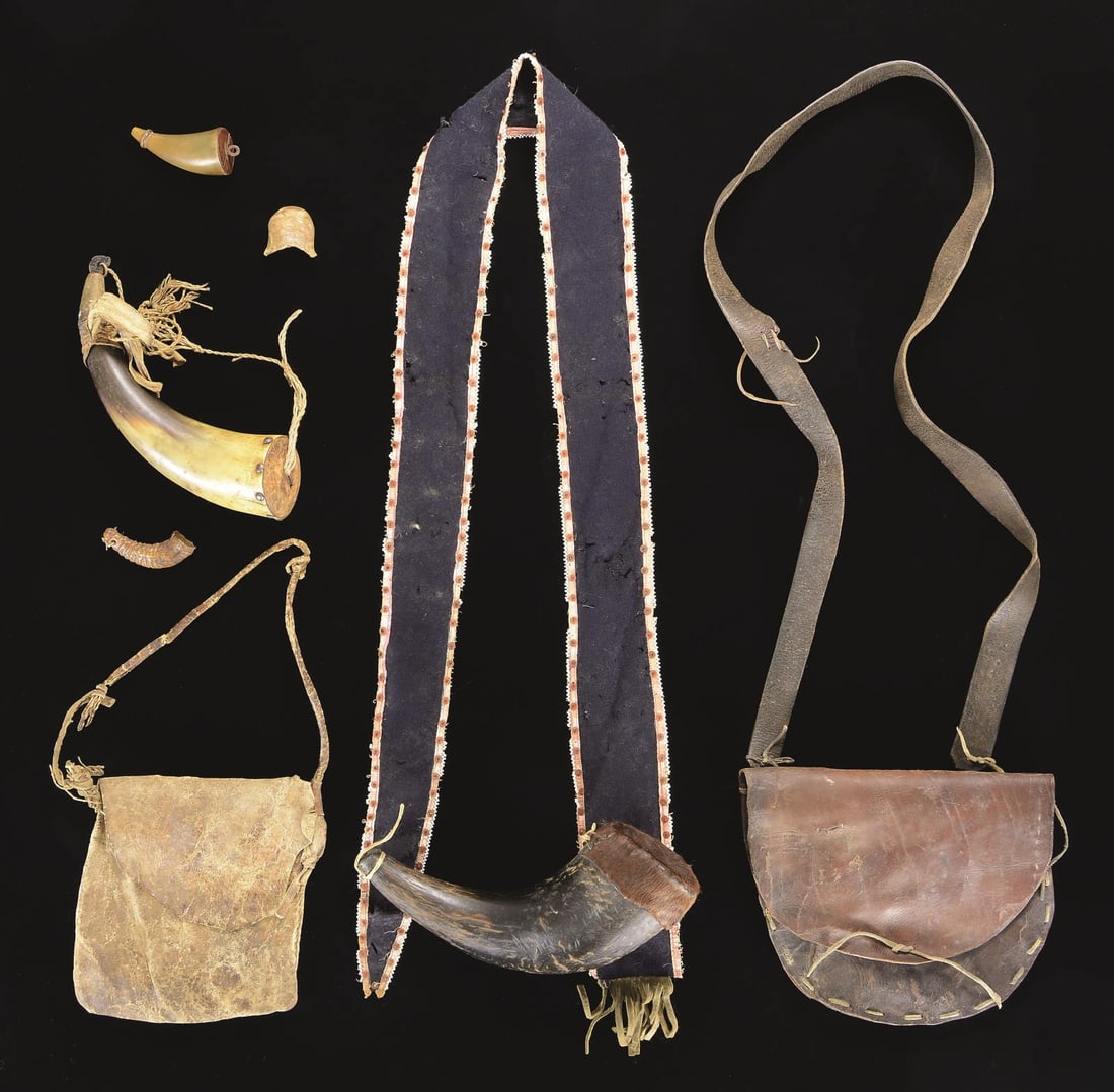 PUBLISHED HUNTING HORNS & ACCESSORIES.: Pictured on page 219 of "The Fur Trade" are 2 horns; one with leather pouch with small ram's horn measures and smaller priming horn. On the same page is Buffalo horn with "elaborate strap made from bl