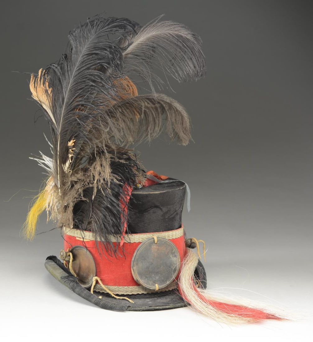 INDIAN-STYLE DECORATED BEAVER TOP HAT.: Pictured on page vii of "The Fur Trade". It is described by the author Milton Von Damm: "This colorful Indian hat is decorated with ostrich feathers, can lids, dyed horsehair and ribbons. It concludes
