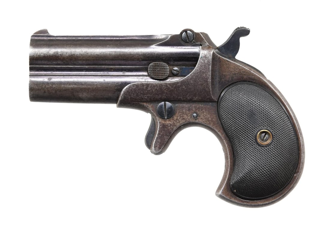 REMINGTON UMC O/U DOUBLE DERINGER.: Cal. 41 RF. S# 219. Bbl. 3" with a manual extractor. The rib is marked "REMINGTON ARMS-U.M.C. CO. ILION, N.Y." (ca. 1911). Blue finish. Two-piece checkered hard rubber grips. CONDITION: 50% lightly fa