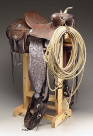 FINELY TOOLED COWBOY SADDLE & SADDLE BAGS.