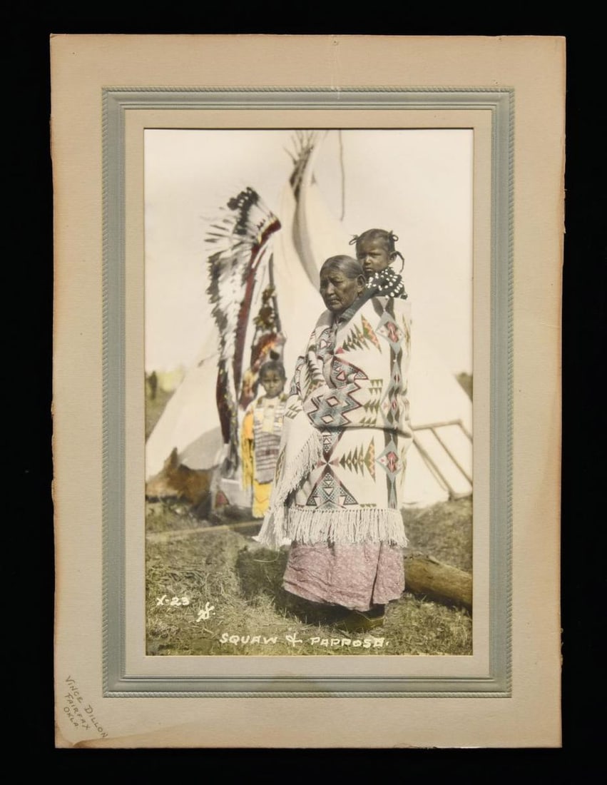 FINE LARGE COLOR IMAGE "SQUAW & PAPOOSE".: 7" x 10" image matted on 14" x 10" board embossed Vince Dillon (1866-1931), Fairfax, OK. Striking image with great colors, teepee in background. UNATTACHED ACCESSORIES: descriptive sheet. CONDITION: v