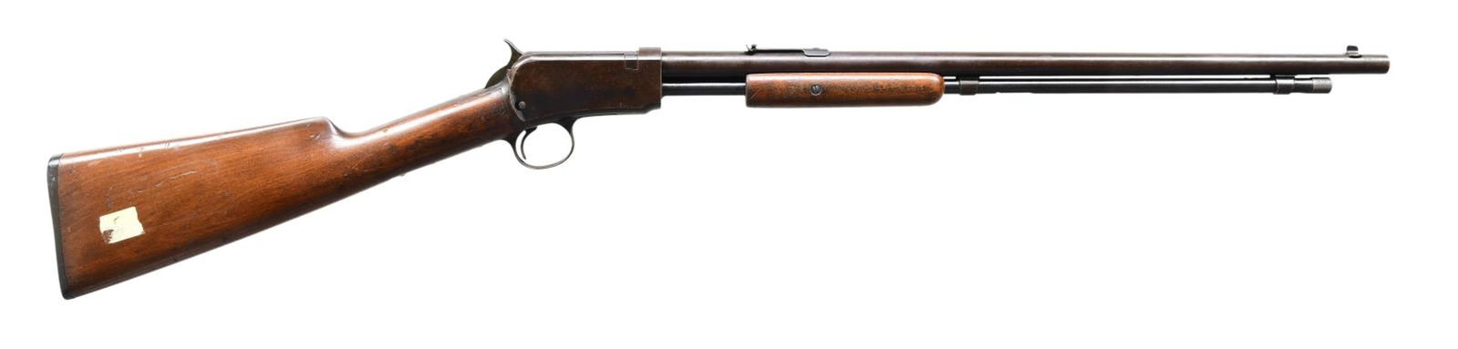 WINCHESTER 1906 PUMP RIFLE.: Cal. 22 S, L, LR. S# 169631B (1910). The round 20" barrel has sporting sights. Takedown action. Walnut stock set with Win. shotgun buttplate. CONDITION: Fair blue mixed with brown patina & marks. Fair