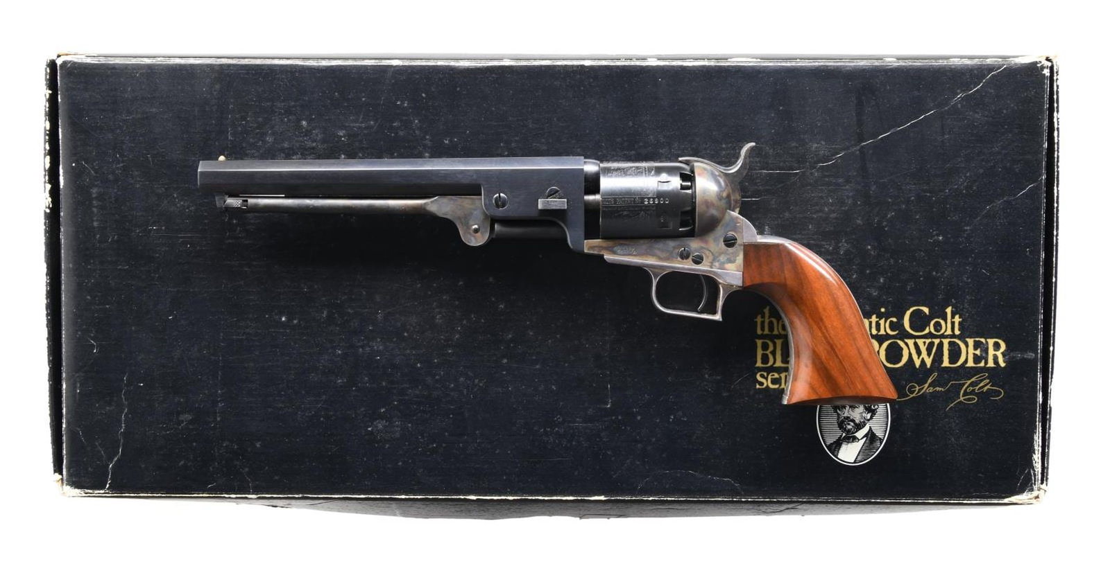 COLT 1851 NAVY BLACK POWDER SERIES REVOLVER.: Cal. 36. S# 26900. Bbl. 7 1/2". Brass post front sight. Blued bbl. & cyl. Cyl. has naval scene. Case colored frame, hammer & loading lever. Silver plated trigger guard & grip frame. Smooth walnut grip