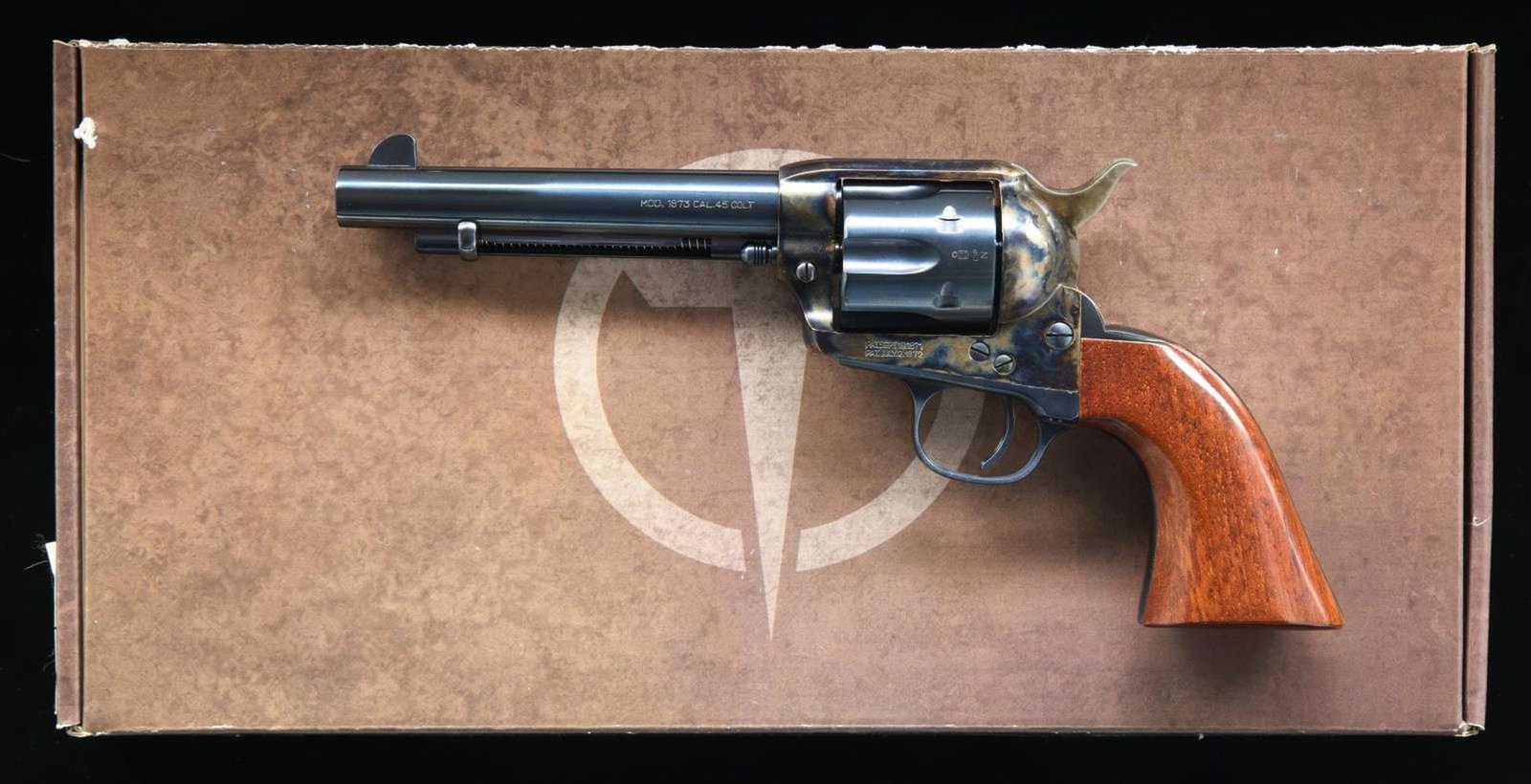 TAYLOR 1873 CATTLEMAN SA REVOLVER.: Cal. 45 Colt. S# UX5289. Bbl. 5 1/2". Blade front sight. Fixed rear sight. Uberti 1873 SAA revolver, imported by Taylor's. Case-colored frame, hammer, and loading gate; other parts have a charcoal blu