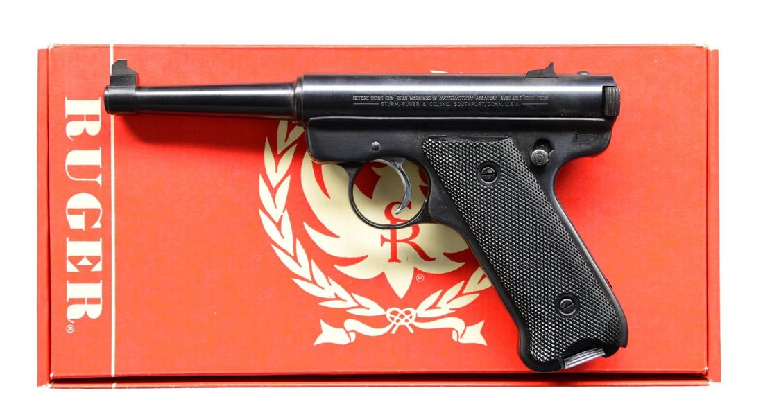 BOXED RUGER STANDARD AUTO SEMI-AUTO PISTOL.: Cal. 22 LR. S# 15-79921. Bbl. 4 3/4" with pinned Patridge sight blade plus dovetailed windage drift adjustable rear sight on receiver. Mfg. 1979 (1949-1982) having normal features to include blued bol