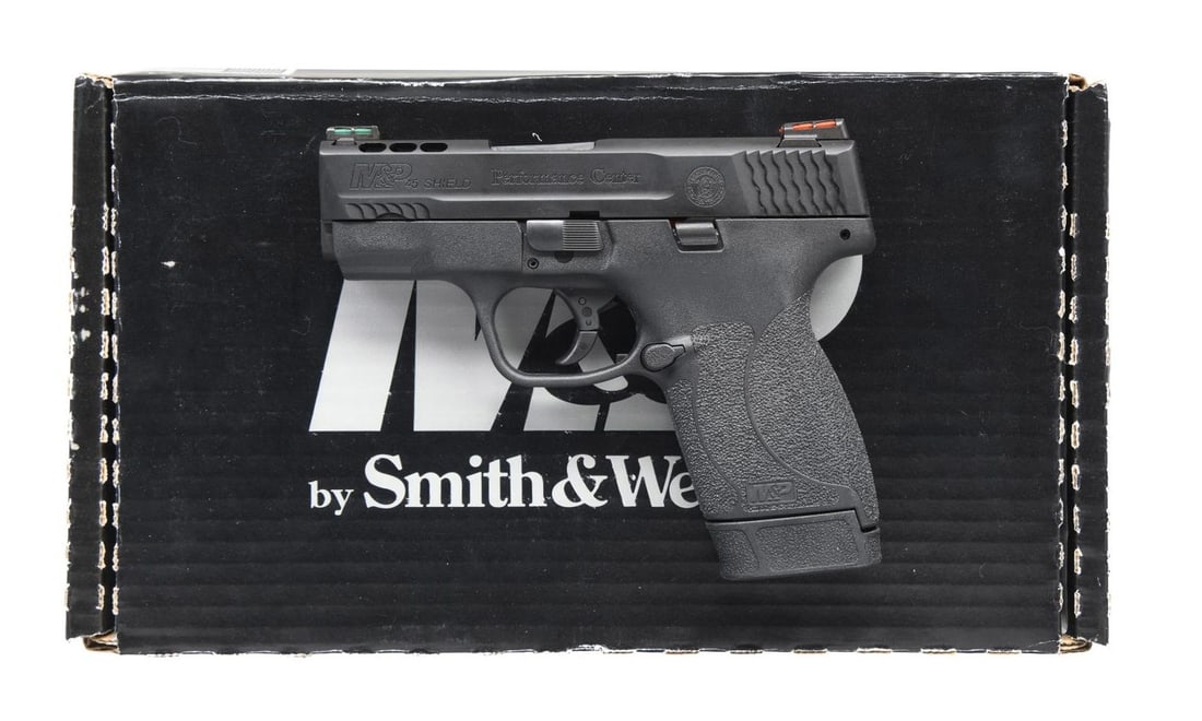 SMITH & WESSON PERFORMANCE CENTER M&P 45 SHIELD: SEMI-AUTOMATIC PISTOL WITH MATCHING FACTORY BOX. Cal. 45 ACP. S# HWP6600. Bbl. 3 1/4". M&P 45 Shield semi-automatic pistol mfg. by Smith & Wesson. Left side of the slide is marked with the model desig