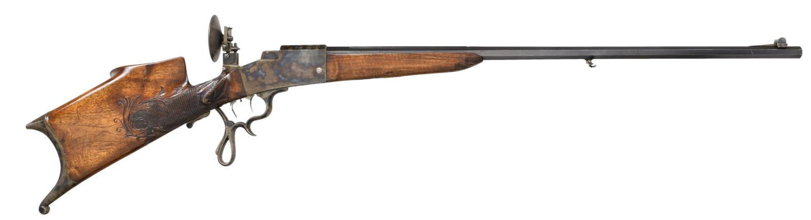 SCHUTZEN RIFLE BY SIMON HEIM.: Cal. 8.15/46R. NSN. The 32 3/8" octagon barrel has a matted top flat with a broad dovetail portion at the rear, engraved "SIMON HEIM NURNBERG". Case-hardened dropping block action with removable trigg