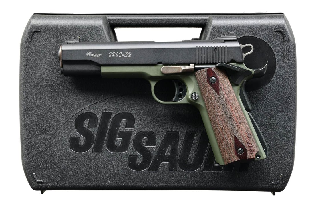 SIG SAUER MODEL 1911-22 SEMI AUTO PISTOL.: Cal. 22 LR. S# F265751. Bbl. 5". Three-dot sights. German-made 1911-style rimfire pistol. Extended beavertail grip safety. Extended ambi safety. Matte black slide. Green-finished frame. Checkered GI-s