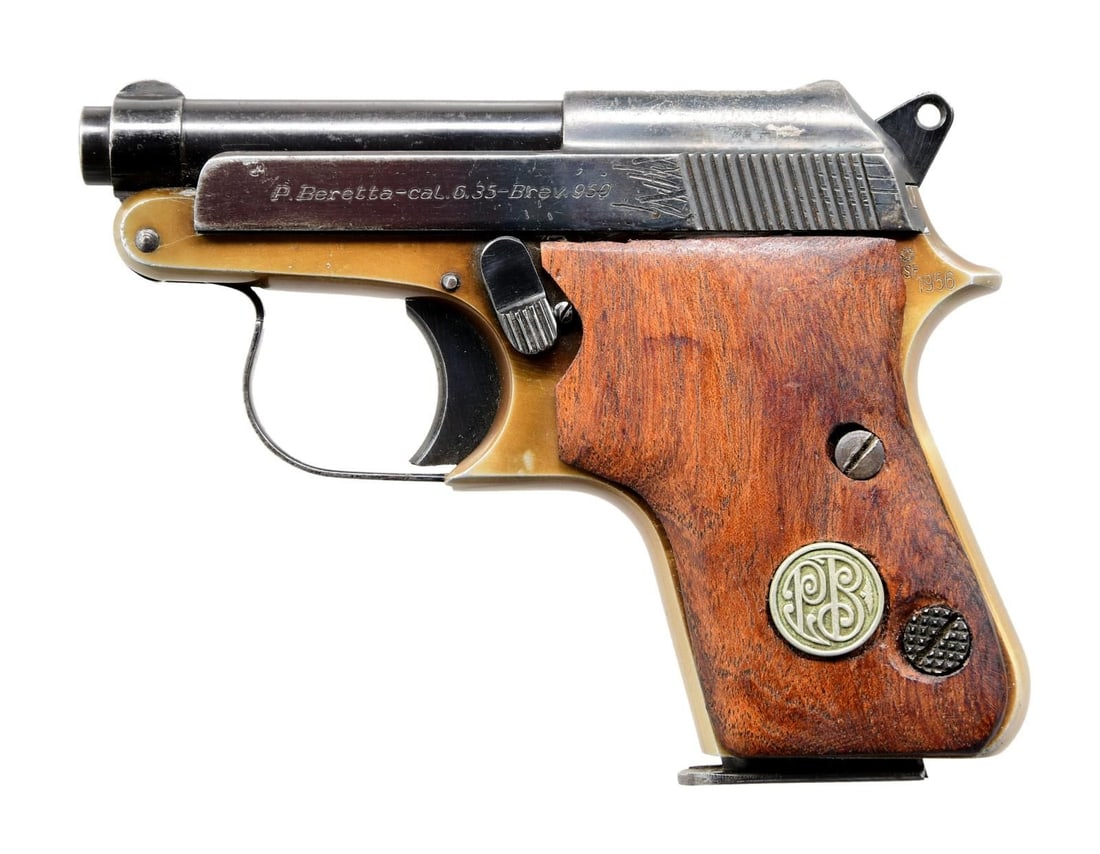 BERETTA 950 SEMI AUTO PISTOL.: Cal. 25 ACP. S# B76634. Bbl. 2 1/2". Blade front sight. V-notch rear sight. Blued slide. Frame has a gold finish with a 1956 date at the left rear. Smooth hardwood grips with silver PB medallions. MAG