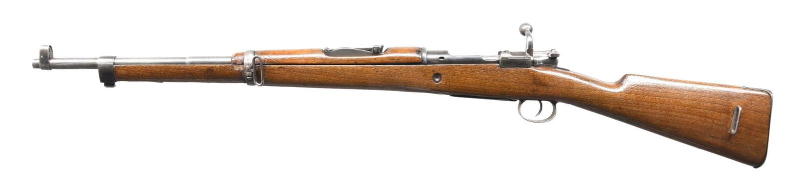 SPANISH MODEL 1916 BOLT ACTION SHORT RIFLE.: Cal. 7mm Mauser. S# 6569. Bbl. 22". Model 1916 bolt action short rifle mfg. at Fabrica De Armas in Oviedo, Spain. Top of receiver is marked with a mostly legible "FABRICA DE ARMAS/ OVIEDO" above an il