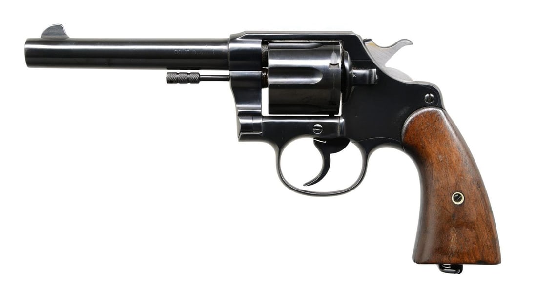 COLT U.S. ARMY MODEL 1909 DA REVOLVER.: Cal. 45 Colt (45 LC). S# 33033 (1911). Standard configuration with 6" barrel, 6 shot fluted cylinder & two piece walnut grips. "RAC" inspector stamp on frame & grips. CONDITION: good reblued metal fin