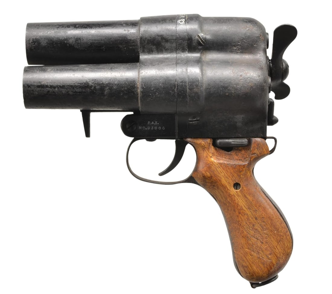 RARE WWII JAPANESE NAVY TYPE 90 NAMBU 3 BBL: FLAREGUN. Cal. 28mm. S# 1501. Numbers match on top of the breech and below the selector lever. Frame is marked on left side over trigger guard "P.A.T." / "NO. 93006". All markings are enhanced in whit
