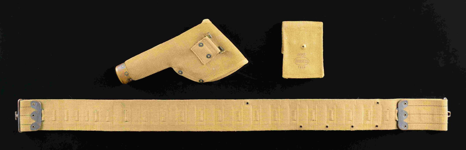 WWI ERA KHAKI WEB GEAR RIG.: 1) MILLS holster appearing to the 6" barrel for the Model 1917 revolver. 2) Russell Sept. 1918 double magazine pocket for 1911 pistol. 3) Mills "2" belt for 12 Gauge shotgun having 30 loops. CONDITION