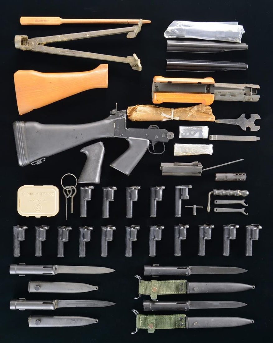 LOT OF ASSORTED FAL PARTS & ACCESSORIES.: Lot of assorted FAL parts and accessories including: 1 complete black enamel finish lower assembly with black polymer buttstock and pistol grip (S# 01180, selector lever marked "S" and "R", with an un