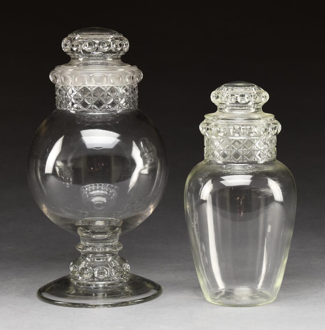 TWO ANTIQUE DAKOTA CLEAR GLASS CANDY JARS. (1 of 1)